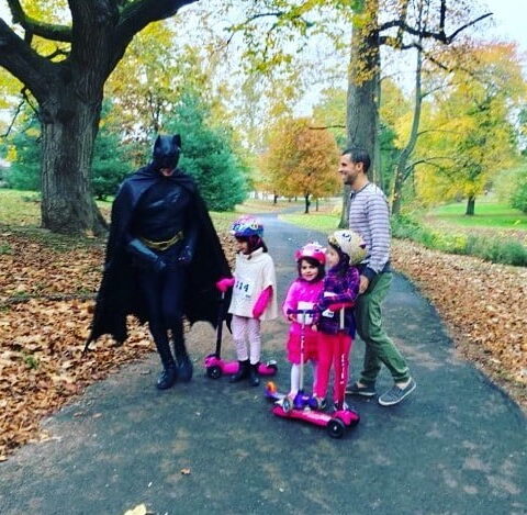 Bat Man running through park