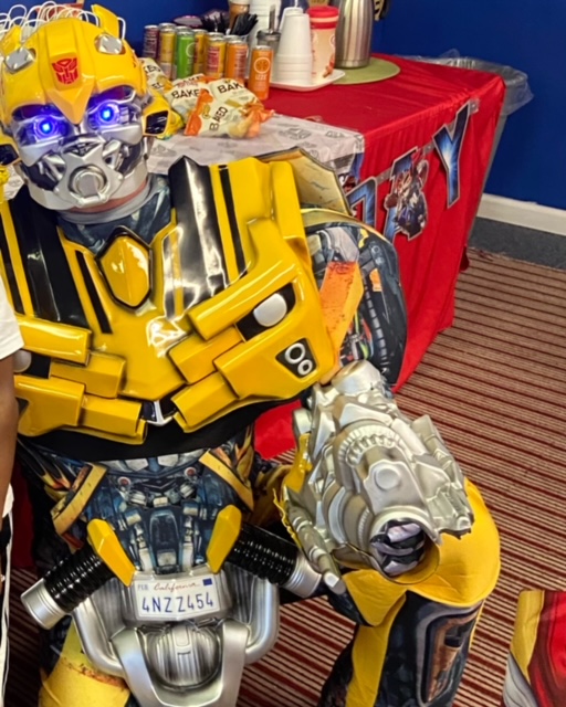 Bumblebee from Transformers in front of a party table | Rent Party Characters