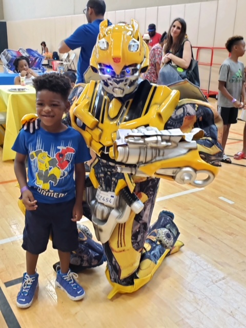 Bumblebee from Transformers with boy at a gym | Rent Party Characters