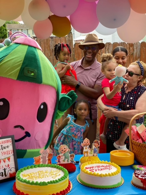 Cocomelon with birthday guests in front of cake | Rent Party Characters