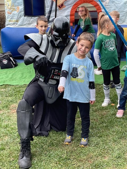 Darth Vader posing with boy | Rent Party Characters