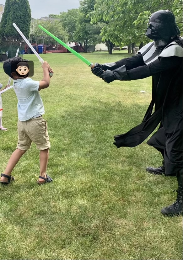 Darth Vader with boy fighting with lightsaber | Rent Party Characters