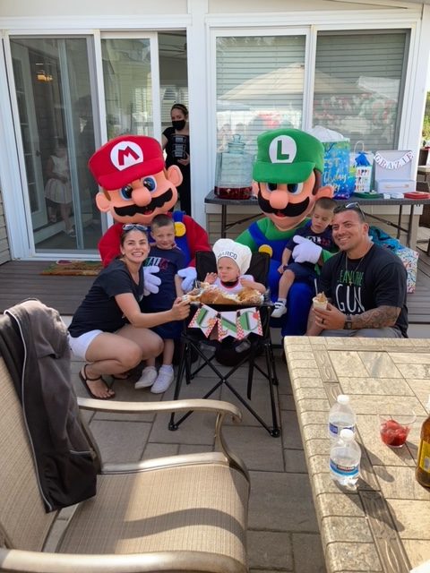 Mario and Luigi with a family outside | Rent Party Characters