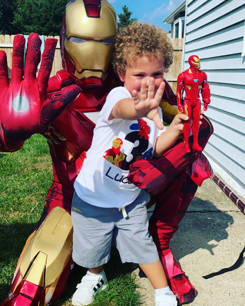 Iron Man doing a hands up pose with a boy | Rent Party Characters
