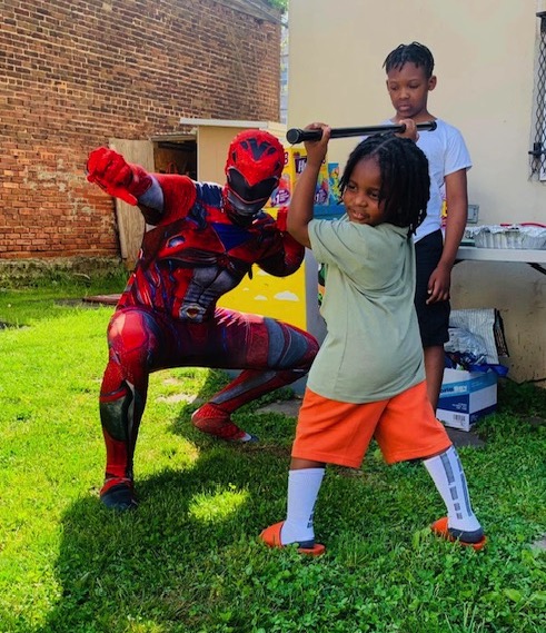 Power Rangers does fight pose with kids | Rent Party Characters