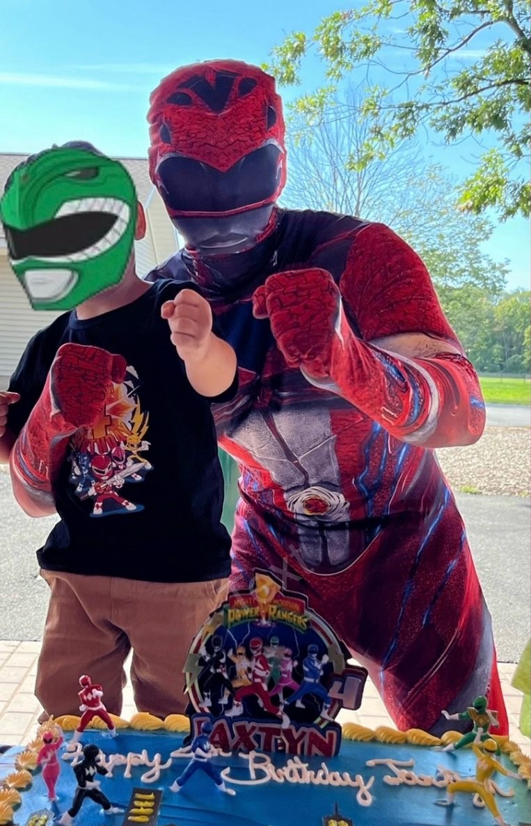 Power Ranger and boy doing a fight pose behind a birthday cake | Rent Party Characters
