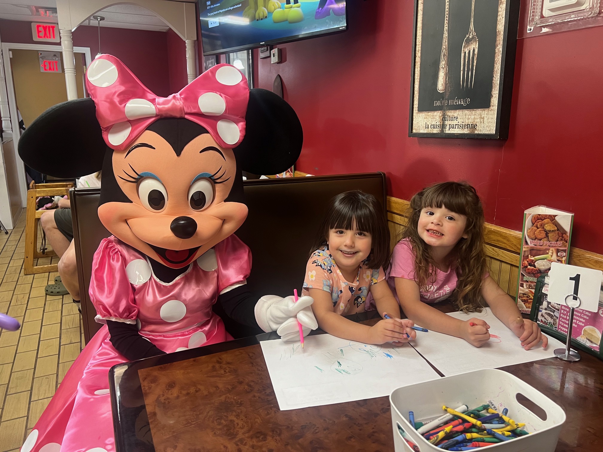 Minnie Mouse coloring at a table | Rent Party Characters