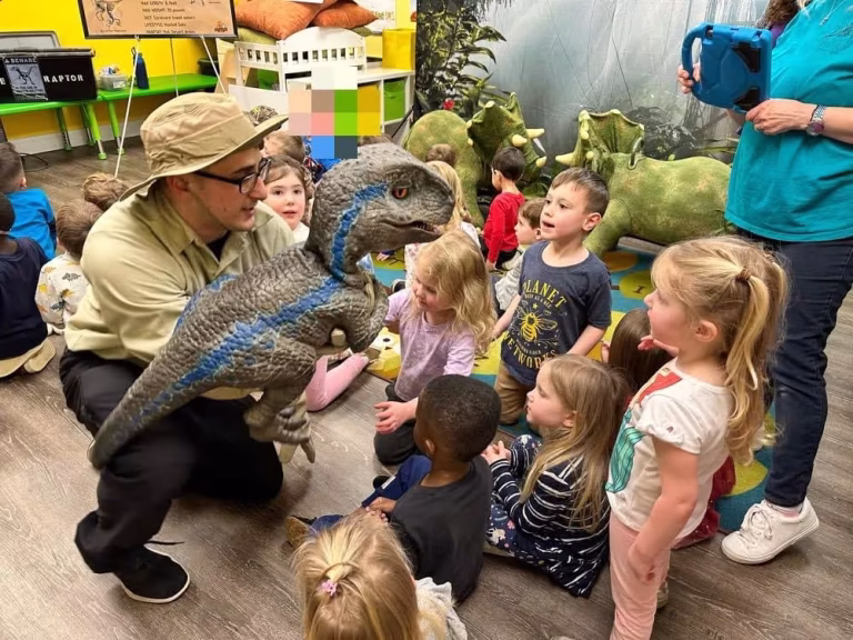 dino class close up with a baby T-Rex